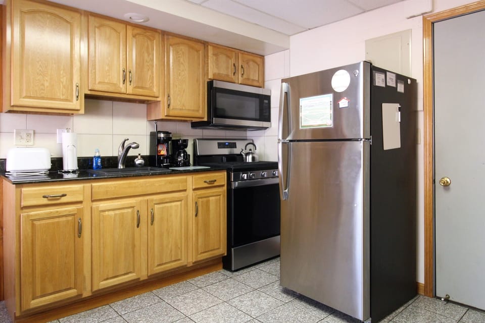 Kitchen has a gas range, microwave, refrigerator with automatic ice maker, k-cup and regular coffee brewers, toaster and more for all the comforts of home.
