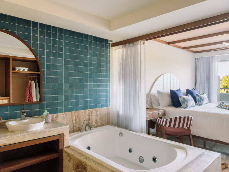 Zel Master Suite | Bathroom | Designer toiletries, hair dryer, bathrobes, slippers