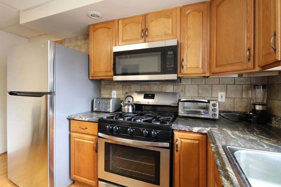 Kitchen with gas range and over the range microwave.  Combo K-cup coffee brewer, toaster, blender and much more!