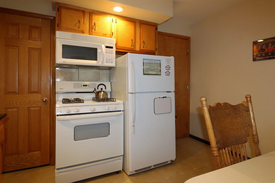 Gas range with over-the-range microwave.  Automatic ice maker in the full size refrigerator.
