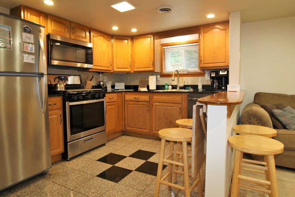 Fold down breakfast bar to sit and talk game strategy over coffee