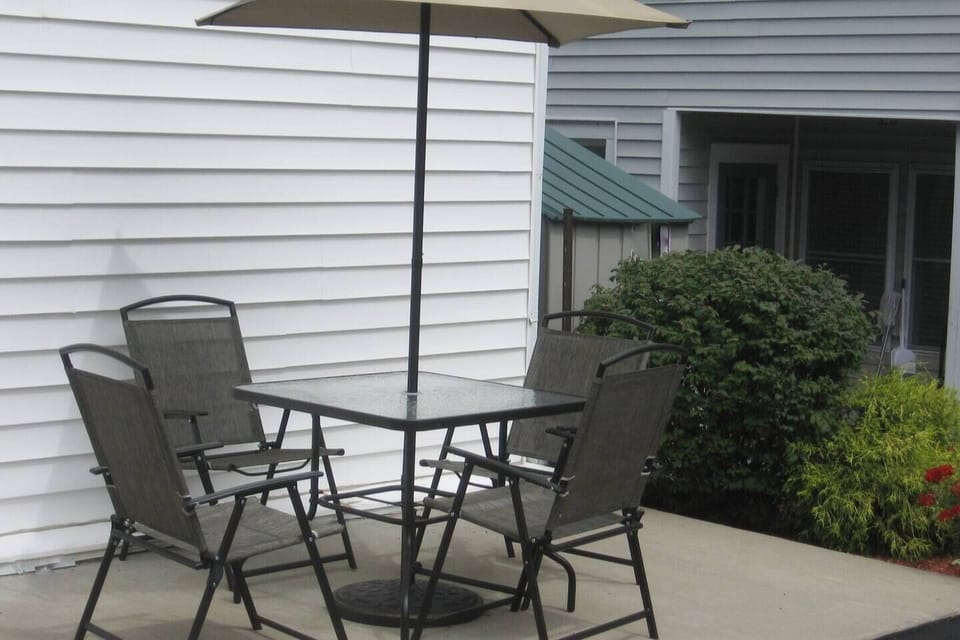 Private Patio area with gas grill behind the house