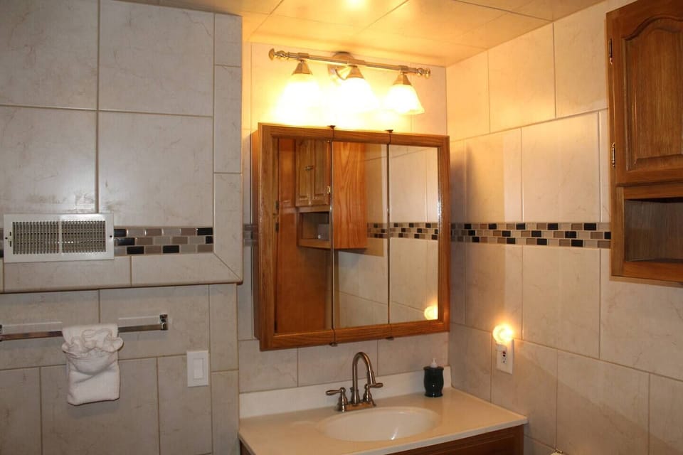 Fully tiled modern bathroom