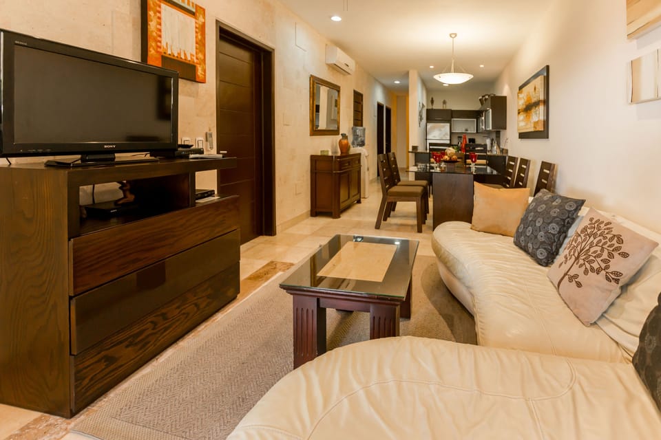 Deluxe Apartment | Living room | Flat-screen TV