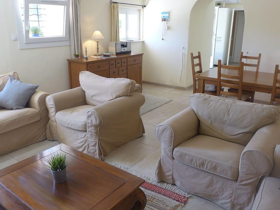 Living Room, Room, Furniture, Property, Couch, Floor, Interior Design, Table, Slipcover, Coffee Table
