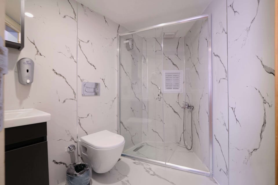 Shower, free toiletries, hair dryer, slippers