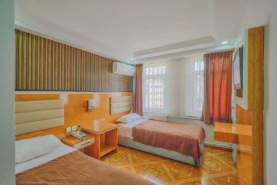 Double or Twin Room | Minibar, in-room safe, blackout drapes, soundproofing