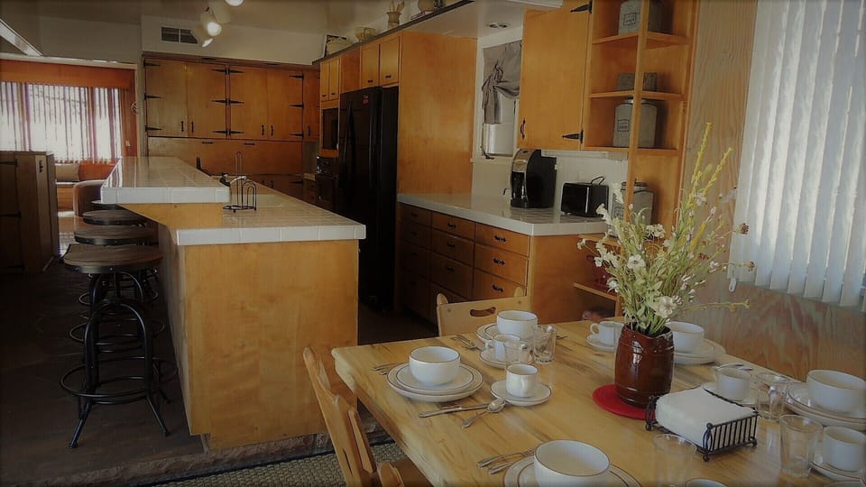 Open kitchen space with at at counter 