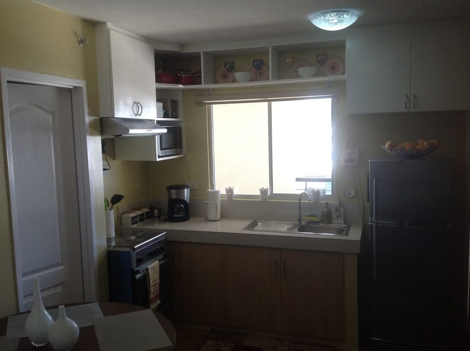 neighboring hillside view can be seen by the kitchen window
