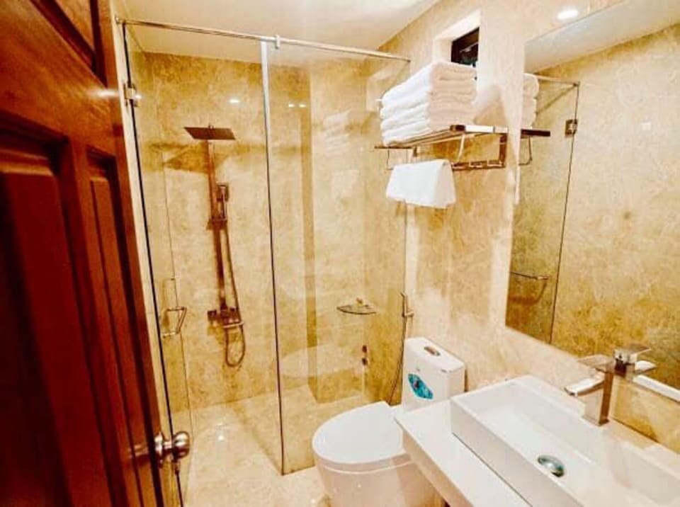 Shower, rainfall showerhead, designer toiletries, hair dryer