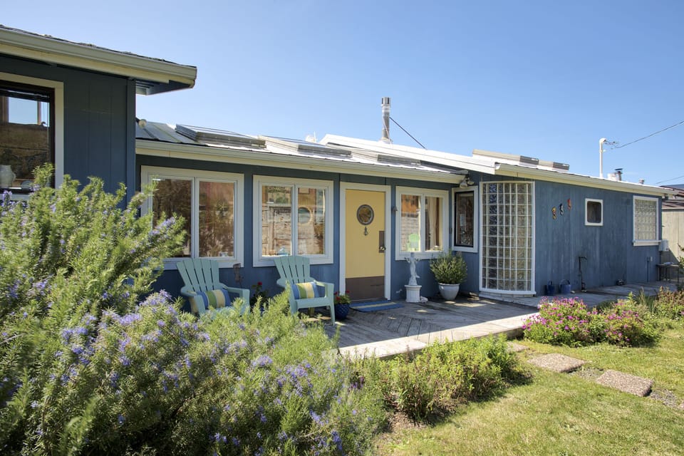 Front yard area with garden, BBQ, and seating