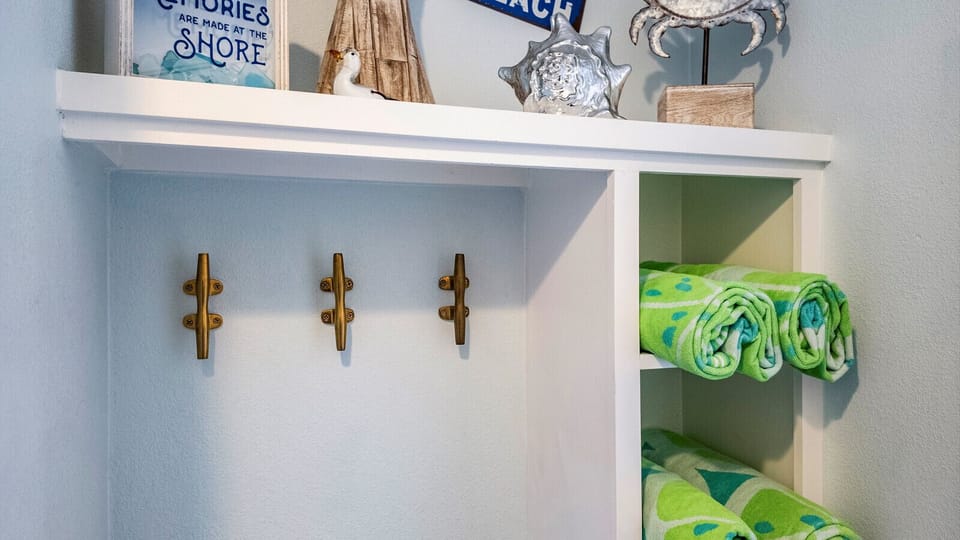 Beach day made easy—grab the provided beach towels at the entryway station and head across the street to the Galveston sand.