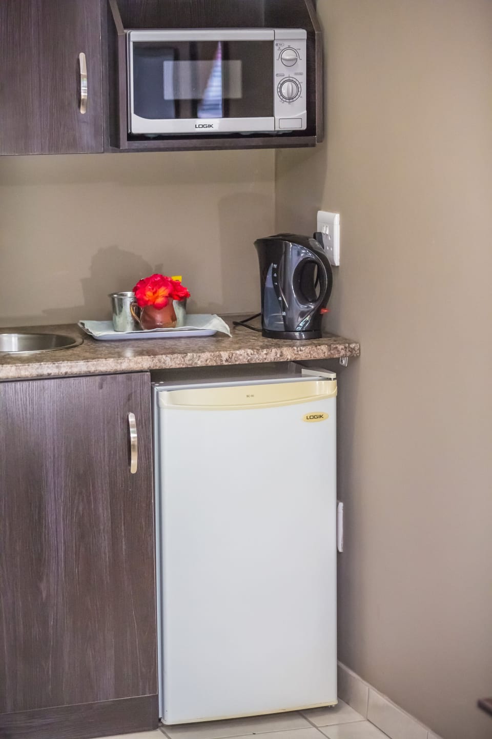 Espresso maker, coffee/tea maker, fridge, microwave