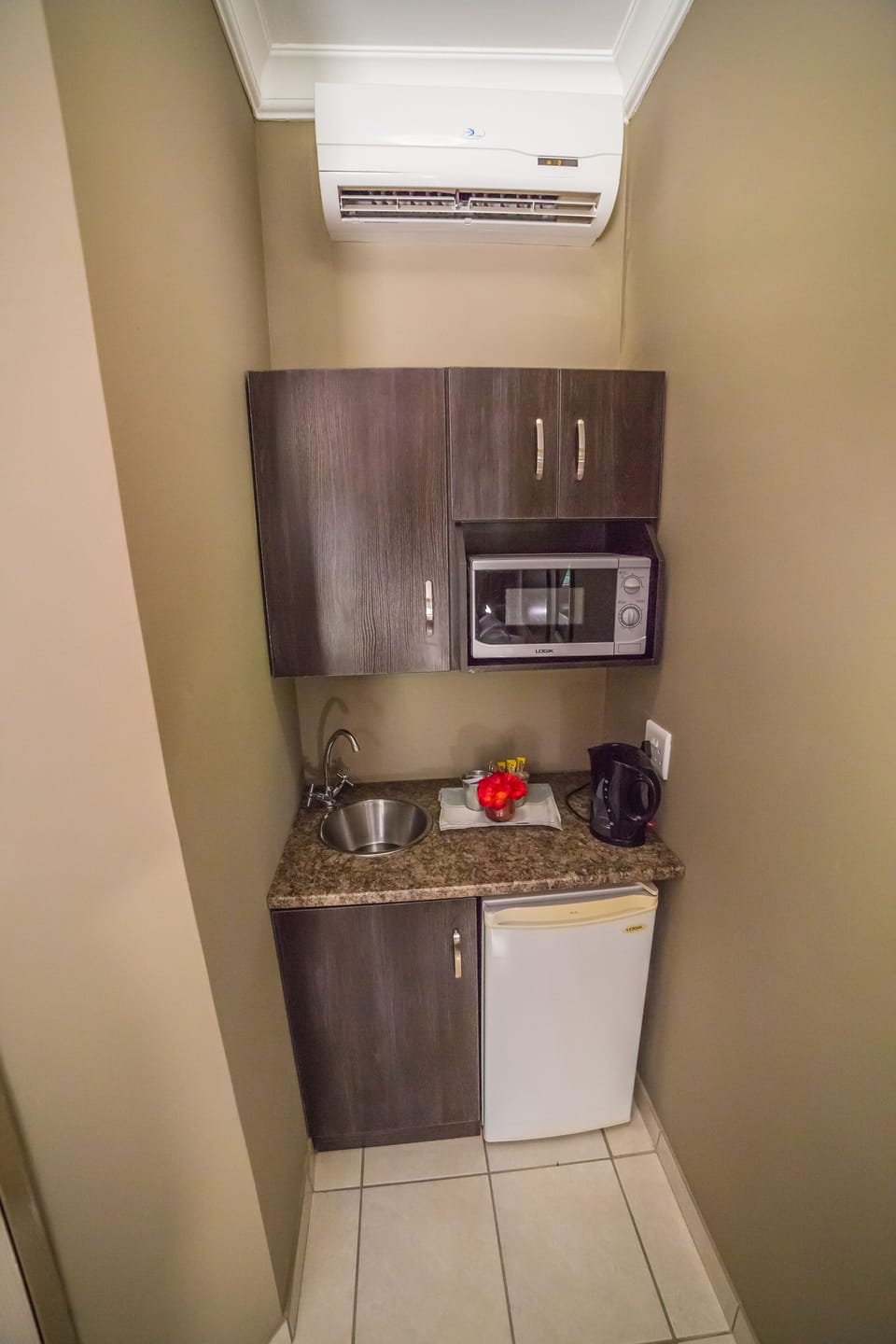 Espresso maker, coffee/tea maker, fridge, microwave