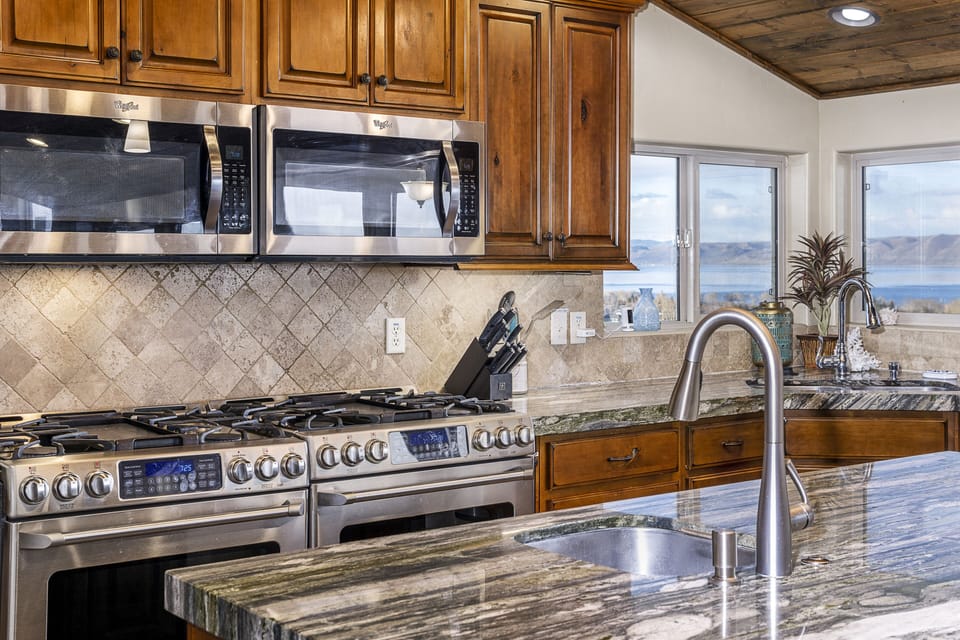 Two stoves, two microwaves, two sinks, and two dishwashers.