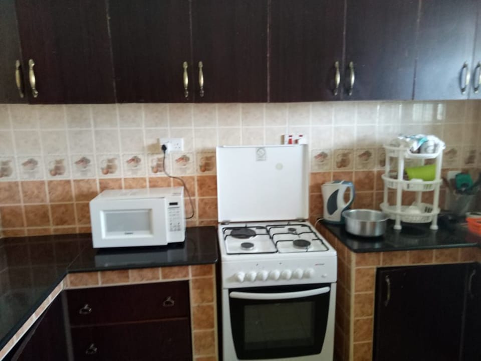 Fridge, microwave, stovetop, cookware/dishes/utensils