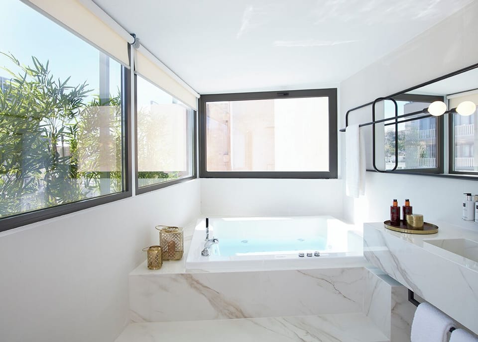 Marblous's Queen | Bathroom | Shower, rainfall showerhead, designer toiletries, hair dryer