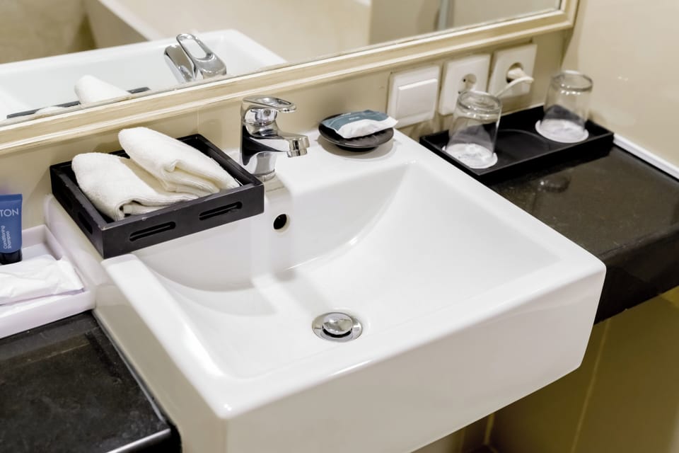 Separate tub and shower, rainfall showerhead, free toiletries