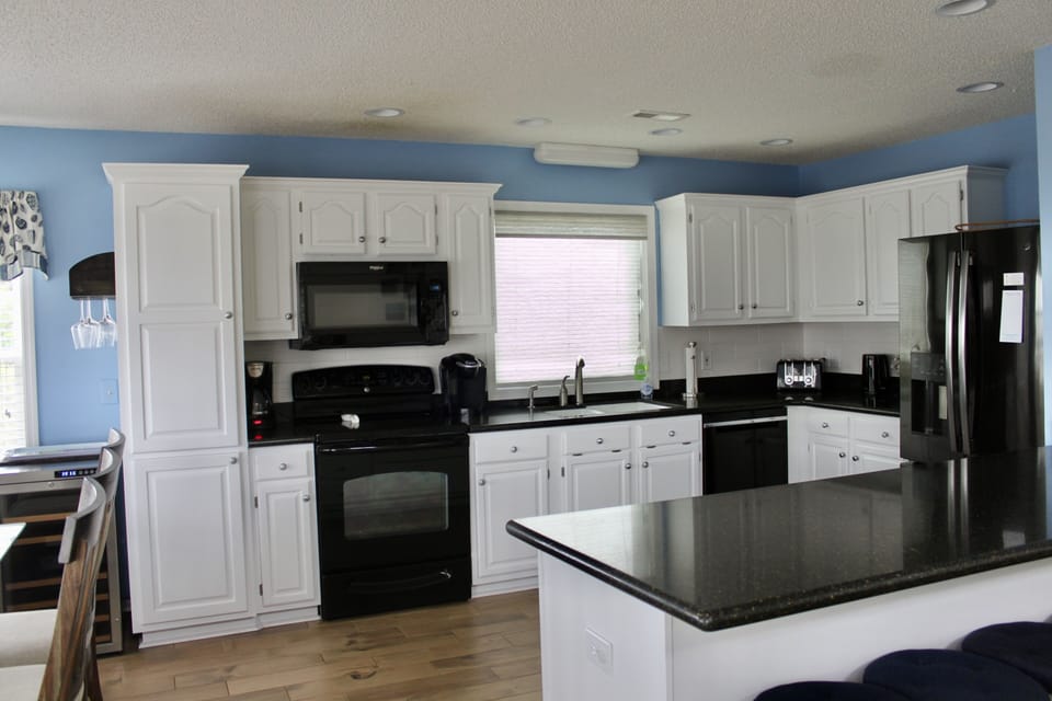 Updated kitchen cabinets and new backsplash.