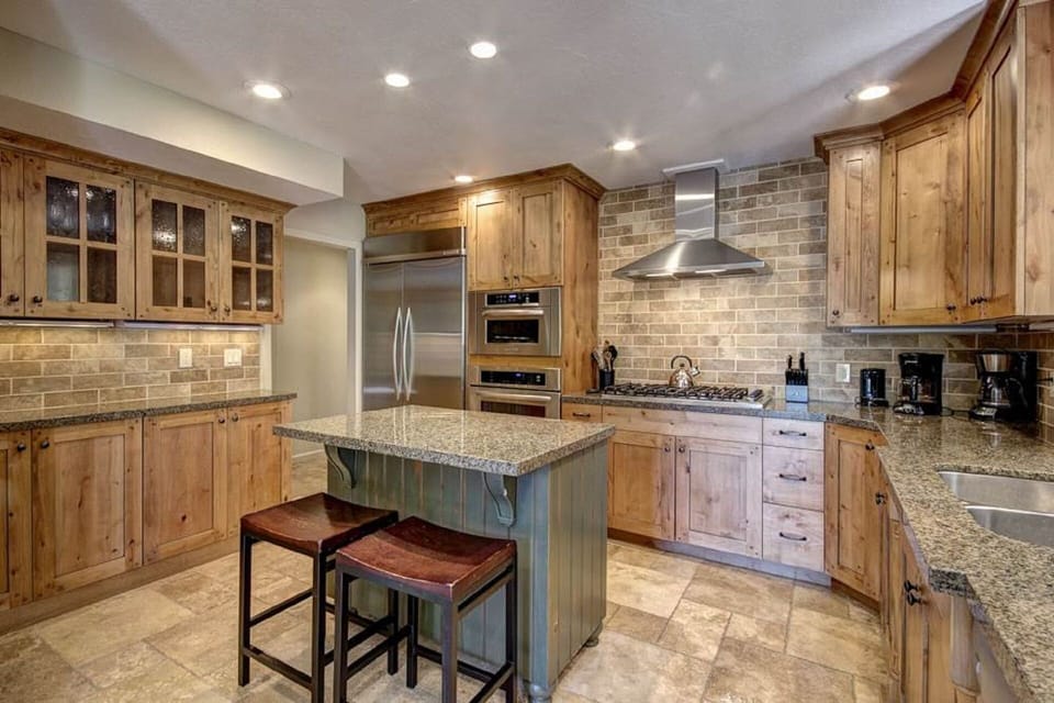 Alder cabinets.  Granite counters.  High end appliances.  Fully stocked.