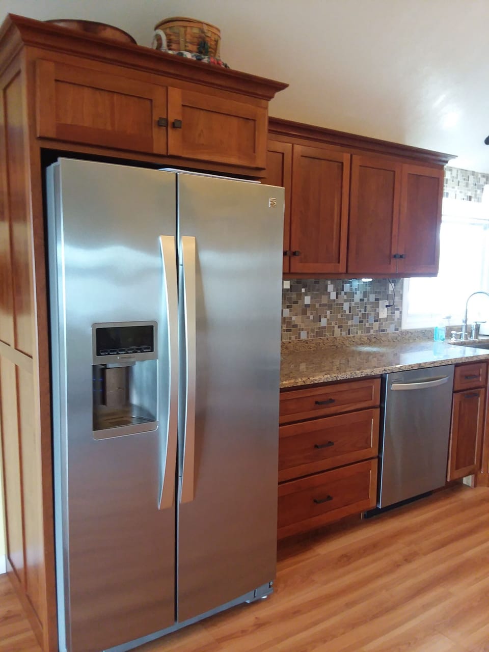 Kitchen with new appliances, granite countertops, tiled backsplash