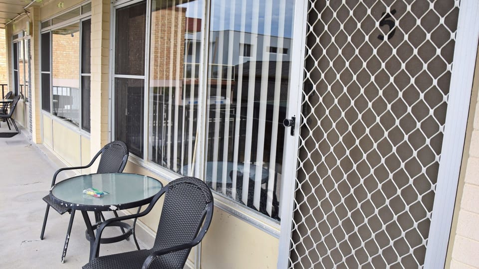 table and chairs outside of unit 5.