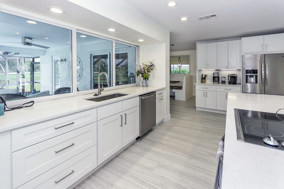 Stainless steel appliances, three way sliding window opens to walk up bar and po