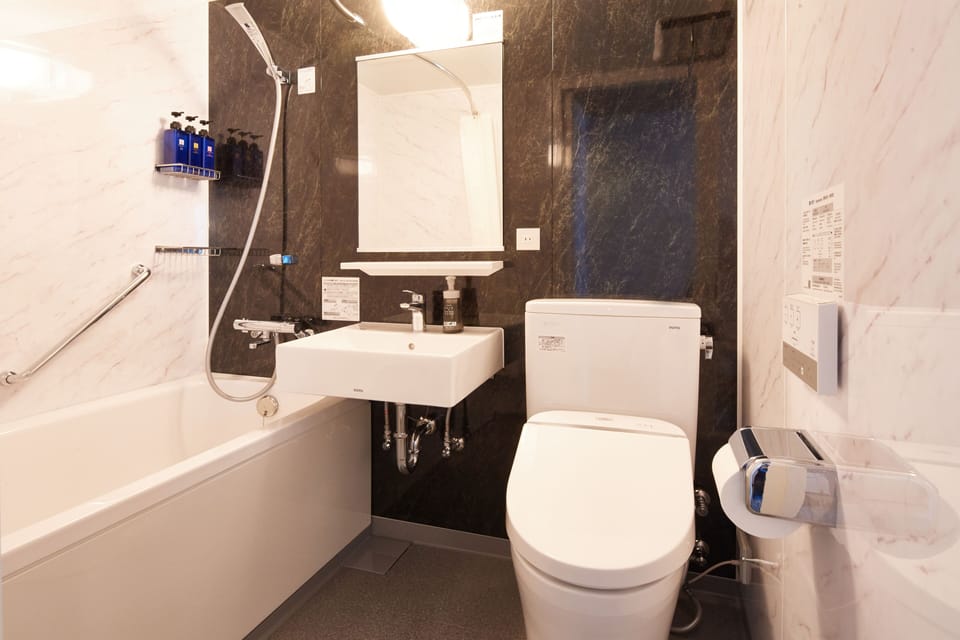 Combined shower/tub, free toiletries, hair dryer, slippers