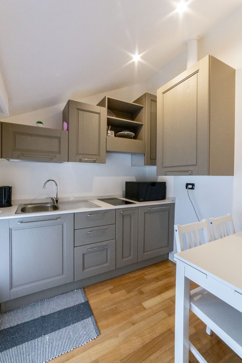 Penthouse (Una Rotonda Sul Mare) | Private kitchen | Full-size fridge, microwave, stovetop, espresso maker