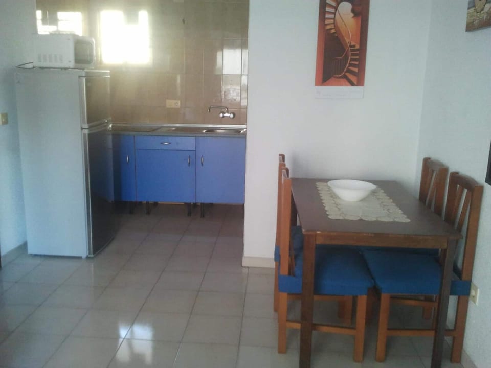 Fridge, microwave, stovetop, cookware/dishes/utensils