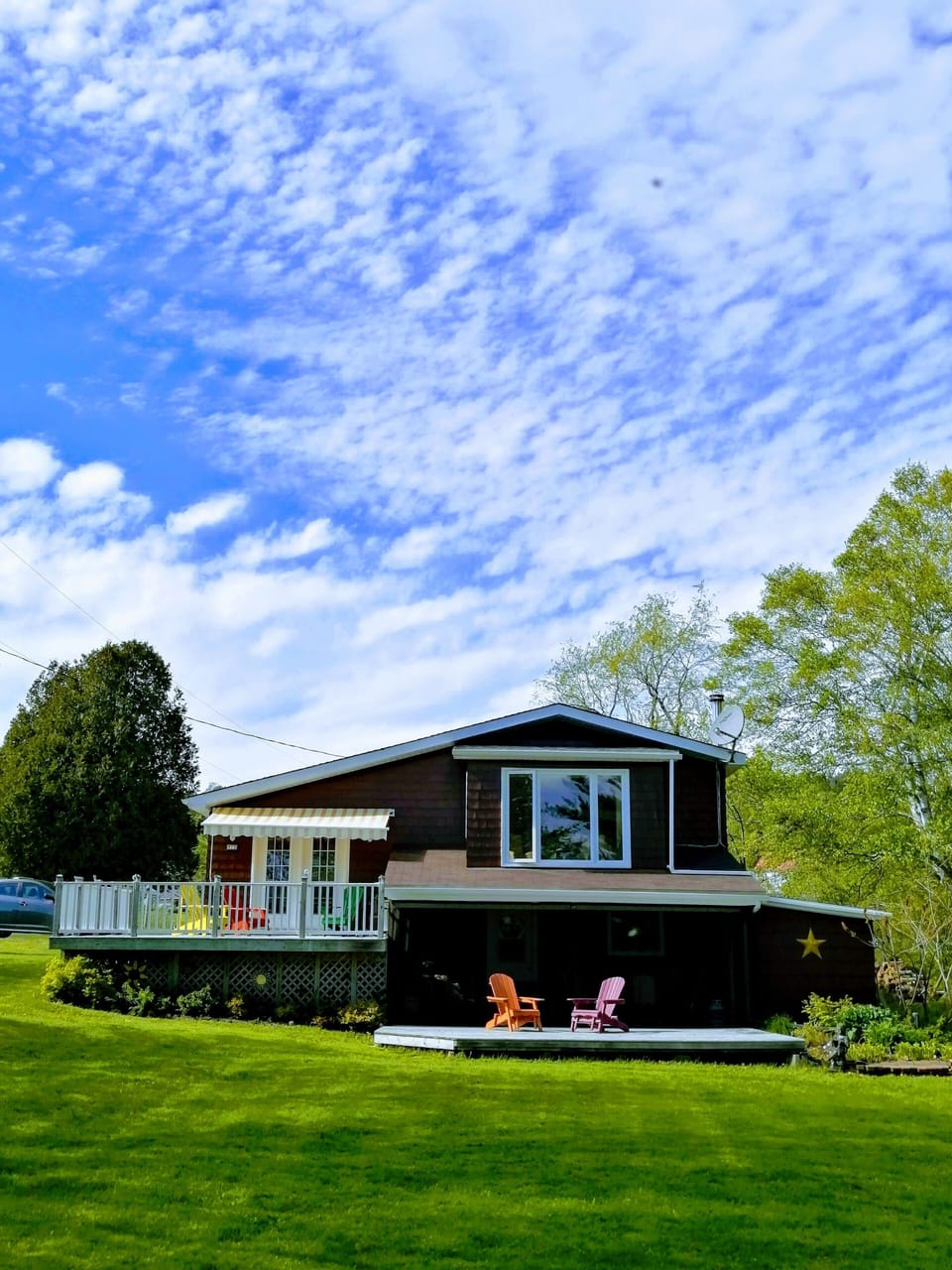 Large deck on top with awning , large deck below is screened in