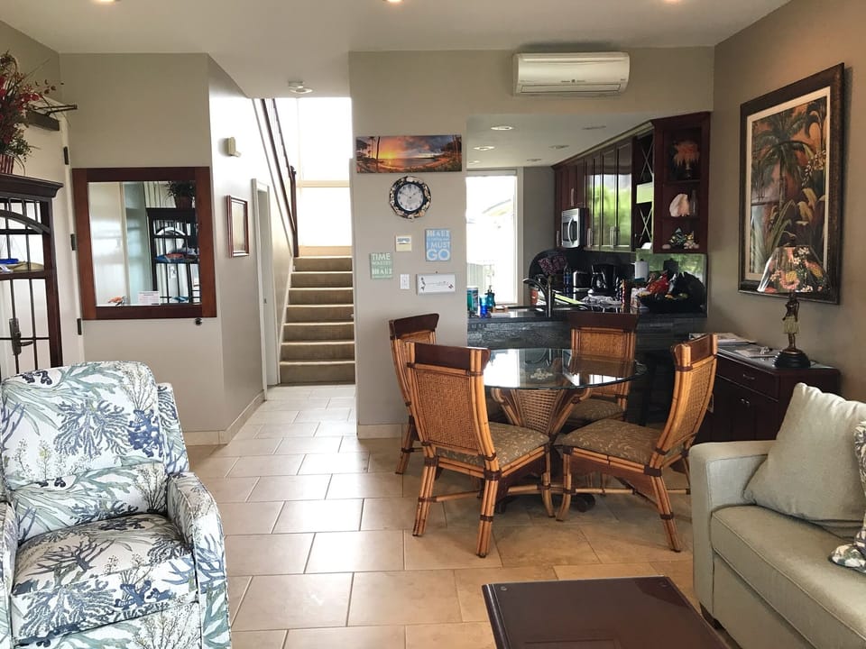 Living area towards kitchen and stairs to upstairs master 