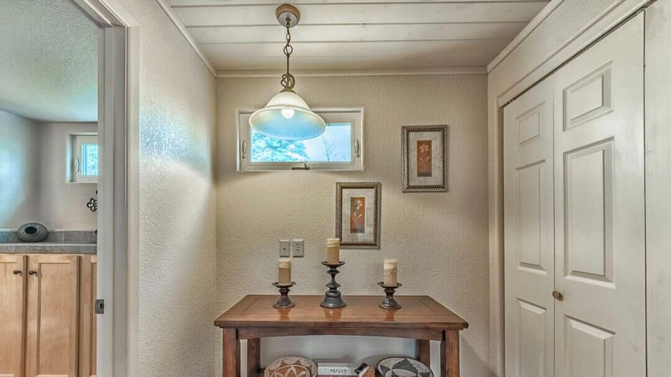 Entry way leading to laundry room and main level bathroom