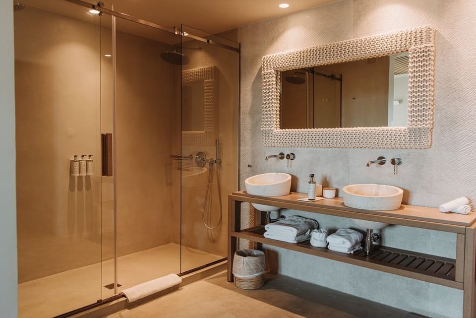 Shower, rainfall showerhead, designer toiletries, hair dryer