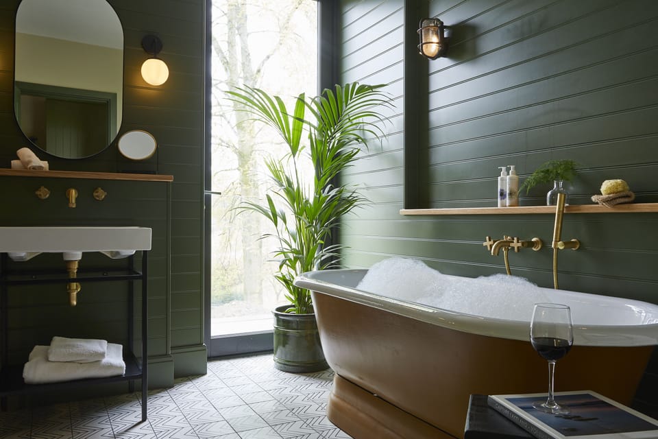 Separate tub and shower, rainfall showerhead, designer toiletries