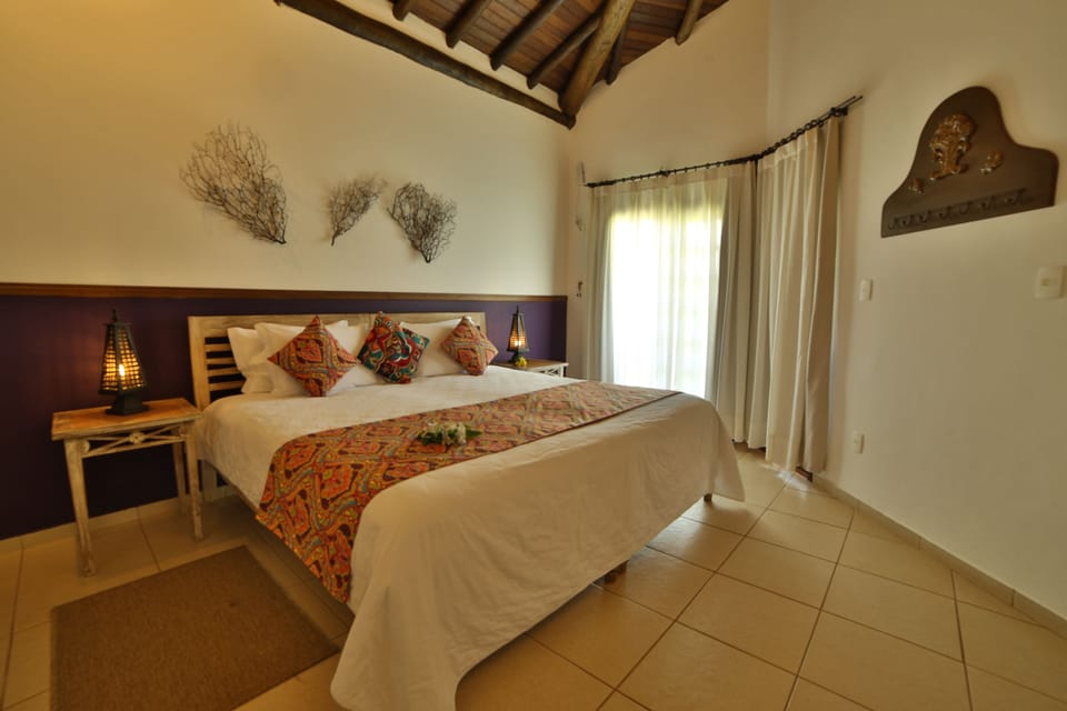 Deluxe Room, Garden View (Fenix) | Minibar, in-room safe, cribs/infant beds, bed sheets