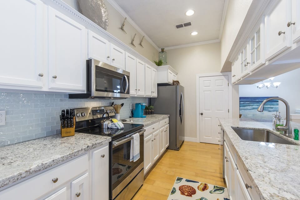 The spacious kitchen offers everything needed for preparing meals throughout your vacation.