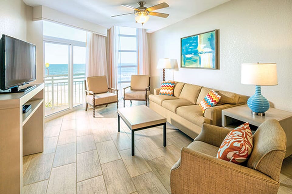 Your comfy living room with beautiful sliding doors let in light & breezes.