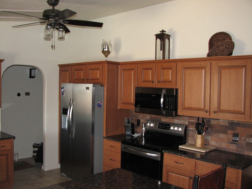 kitchen area with new granite countertops and all new appliances