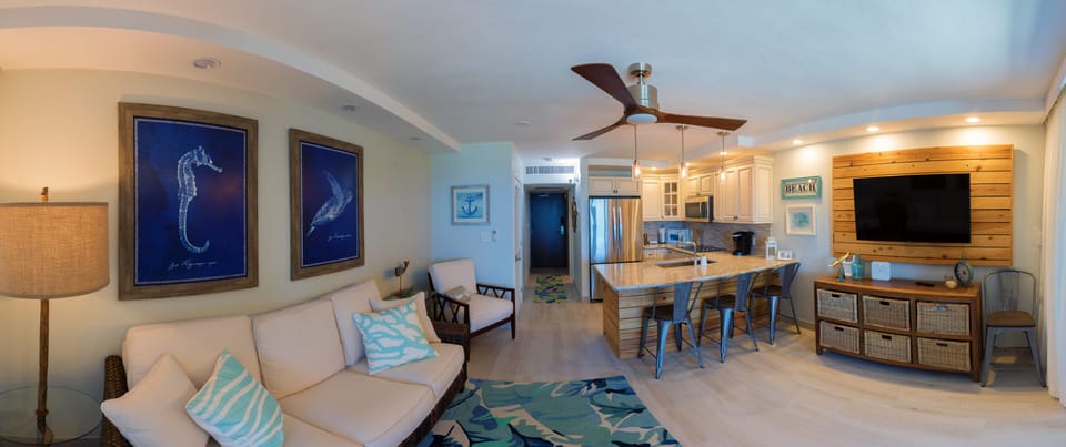 Main level with living room, kitchen, and full bath