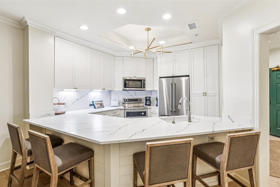Kitchen with Breakfast Counter at 8124 Wendover Dunes