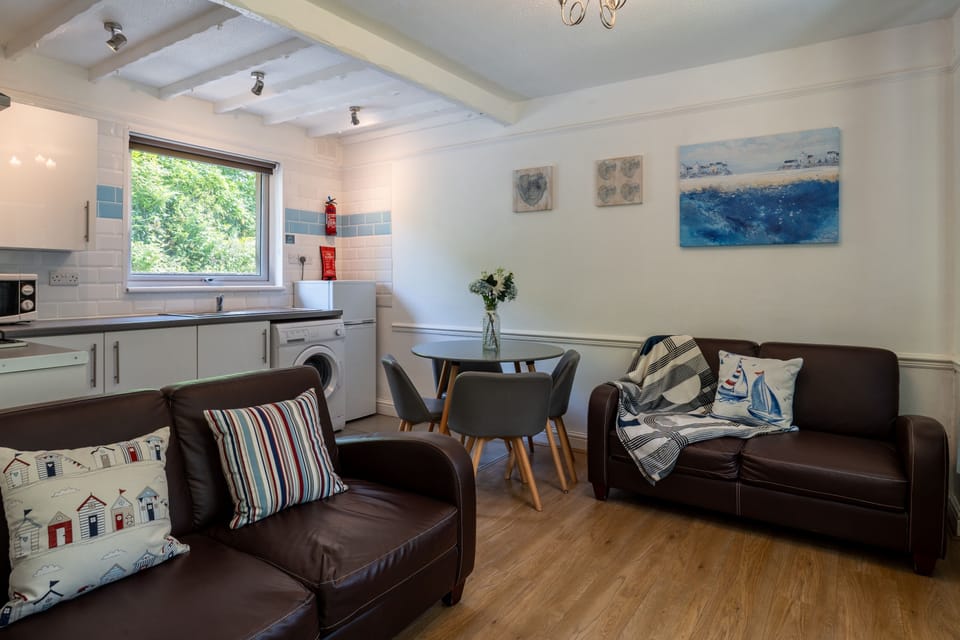 Cabin, 2 Bedrooms | Living area | 32-inch flat-screen TV with satellite channels, TV, table tennis