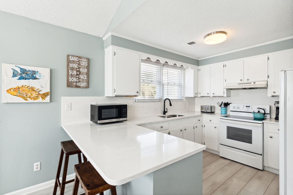 Open kitchen area with plenty of counter space to accommodate your cooking needs