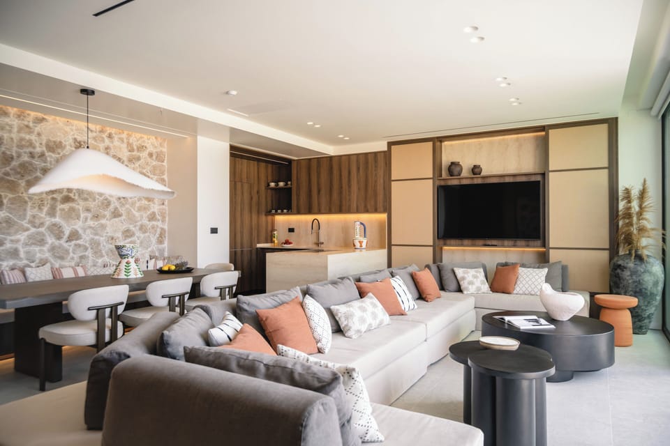 Relax indoors with a 65-inch Smart TV and coastal elegance.