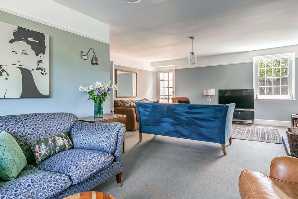 Downstairs laundry and shower room with access to rear courtyard.