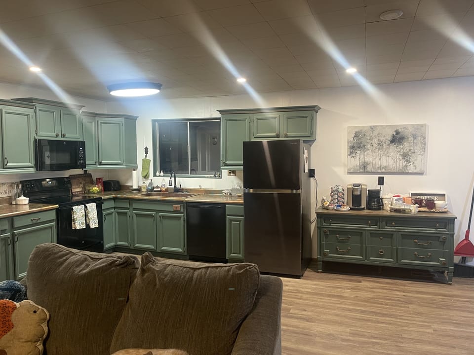 Large kitchen with dishes, pots, and staples you need for cooking 