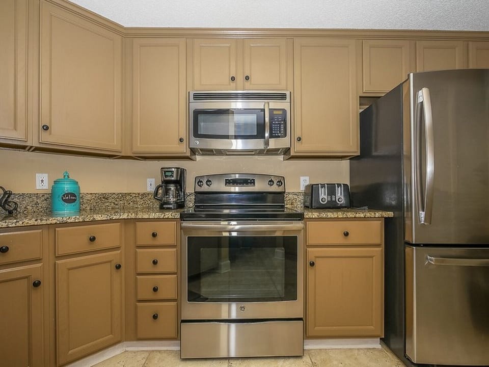 Fully Equipped Kitchen Looks Out to Living Room at 3403 Windsor Court South
