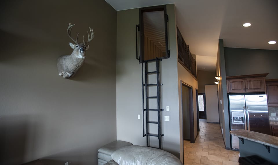 Ladder to Kids Loft Above Wet Bar