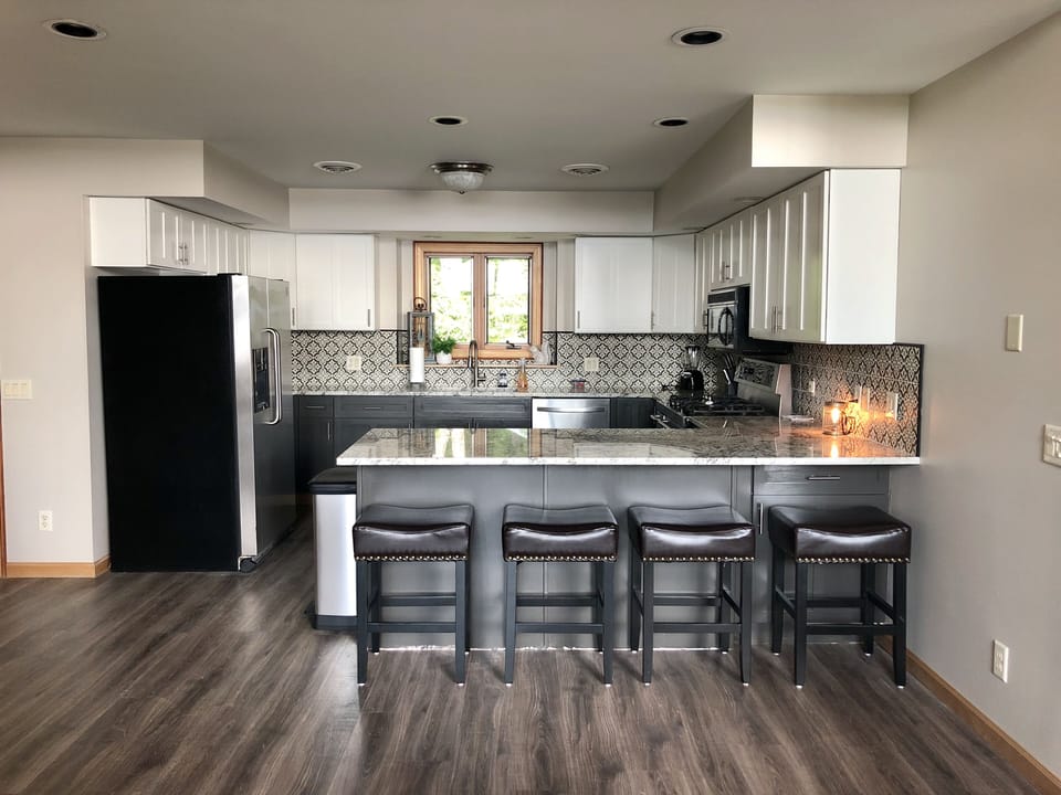 Fully stocked kitchen with bar seating. 