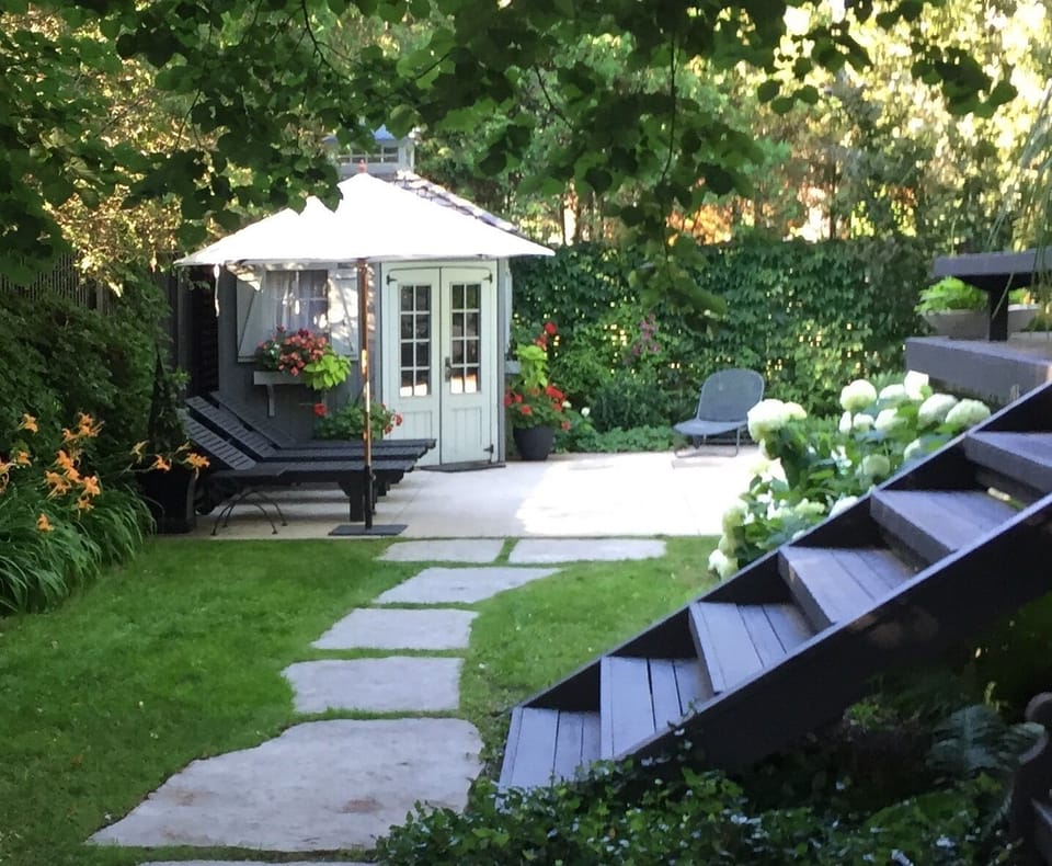 View of yard and pool cabana